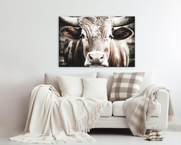 a living room with a couch and a cow on the wall