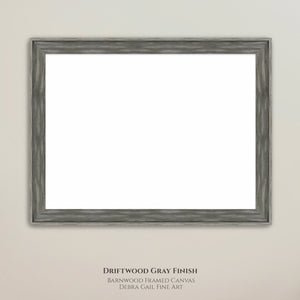 a simple, unadorned gray wooden frame with a blank white canvas inside, hanging on a plain wall.
