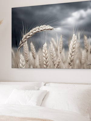 a bedroom with a large bed, a painting of wheat in the background, and a potted plant on the side.