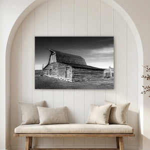 Black and white canvas of historic Mormon Row barn in Wyoming with dramatic sky and rustic wooden architecture.