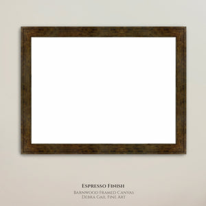 a brown wooden frame with a blank white canvas inside, hanging on a wall.