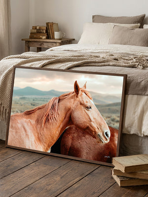 Fine art western horse portrait featuring a chestnut horse with flowing mane and a second horse against a soft Wyoming-inspired prairie landscape.