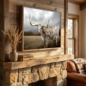 Close-up of Texas Longhorn art in a handcrafted reclaimed barnwood frame